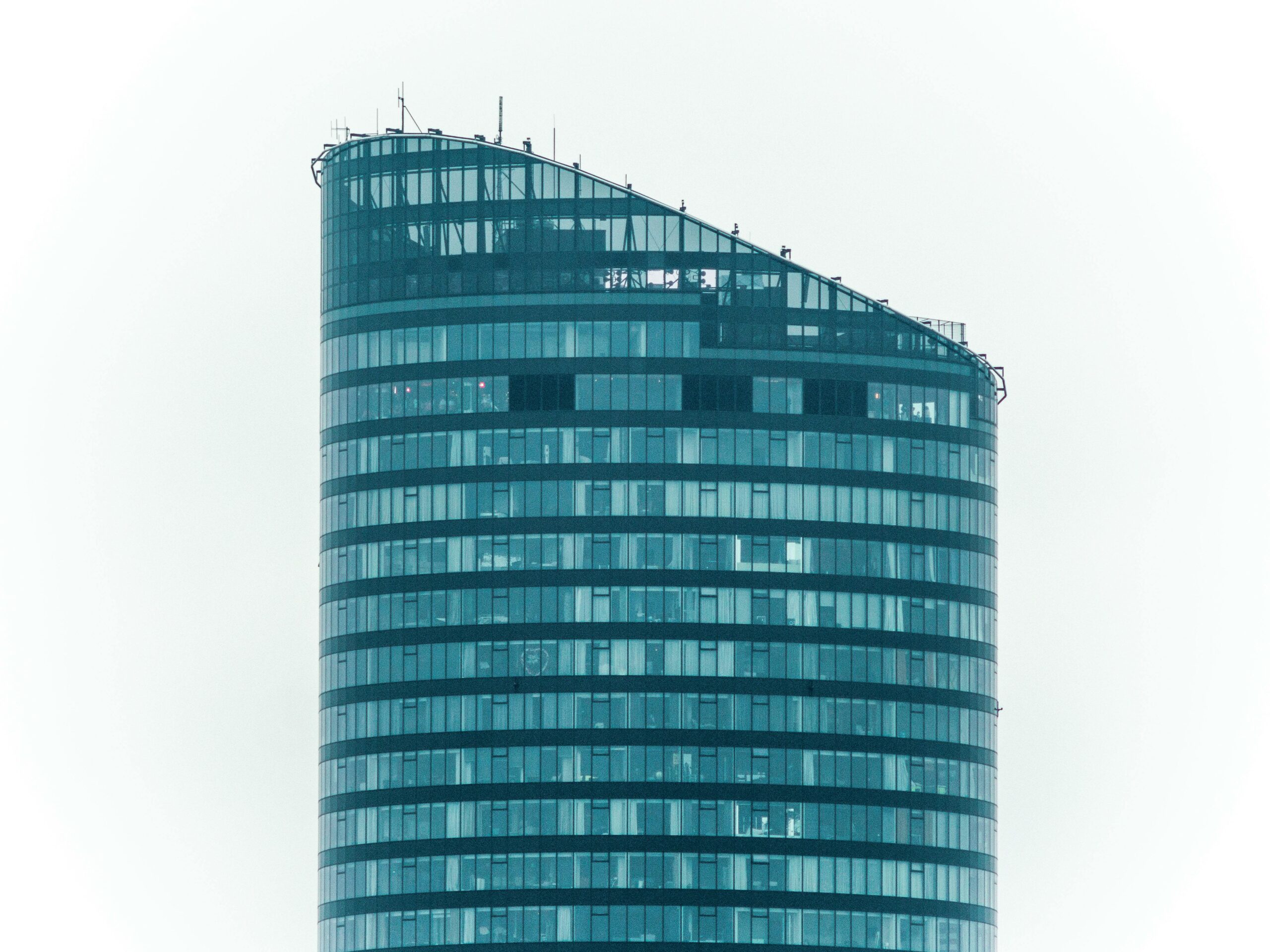 A sleek, modern skyscraper in Wrocław, Poland, showcasing contemporary architecture.